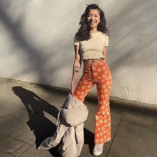 Y2K floral flare-pants outfit photo with noise and warm tones
